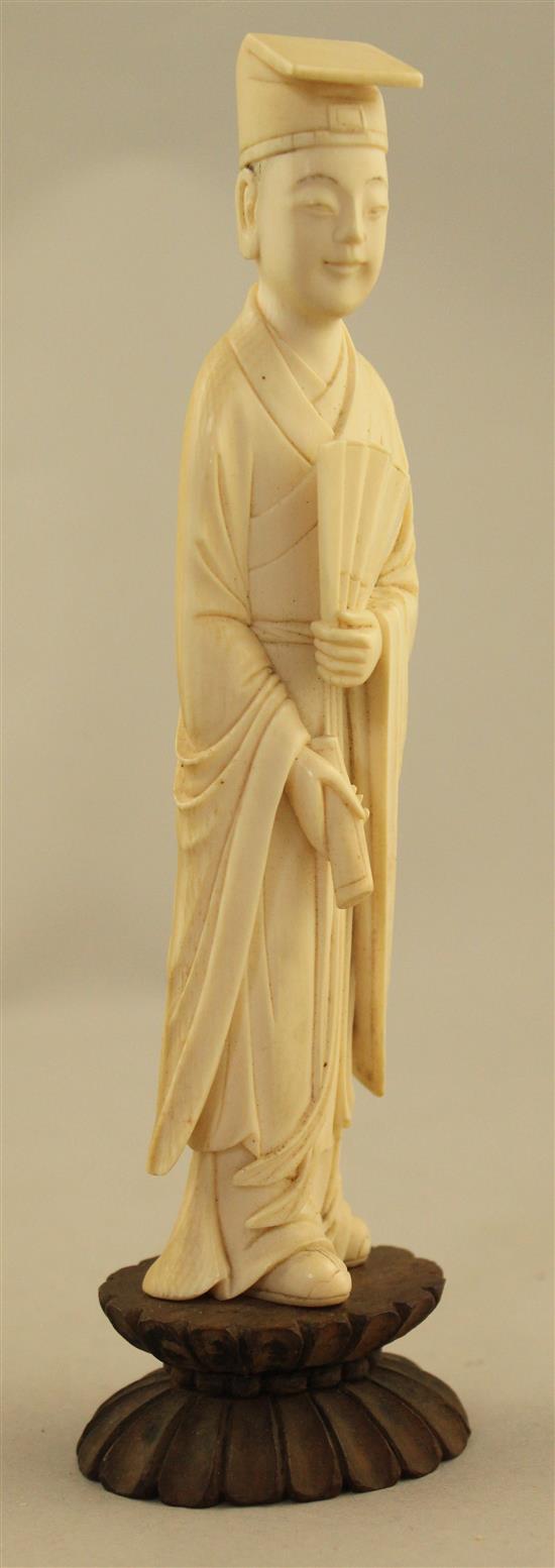 A Chinese ivory figure of a scholar, early 20th century, 17.5cm incl. stand, fitted box